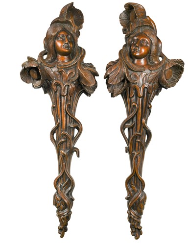 Lot 877 - A pair of carved walnut Art Nouveau wall brackets