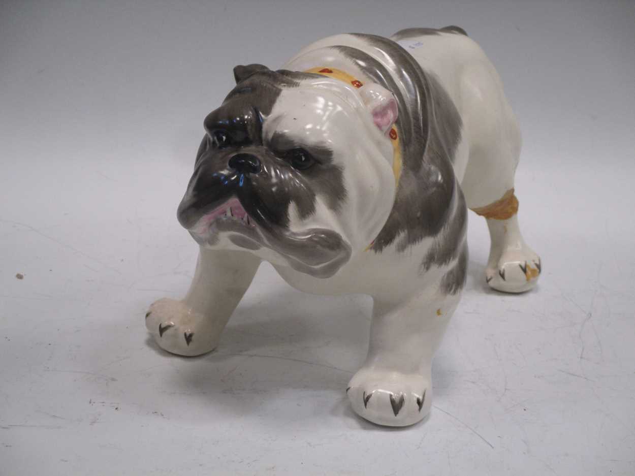 Lot 7 - A model bulldog together with three pairs of...