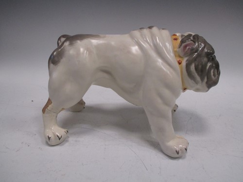 Lot 7 - A model bulldog together with three pairs of...