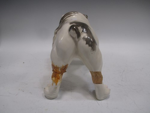 Lot 7 - A model bulldog together with three pairs of...