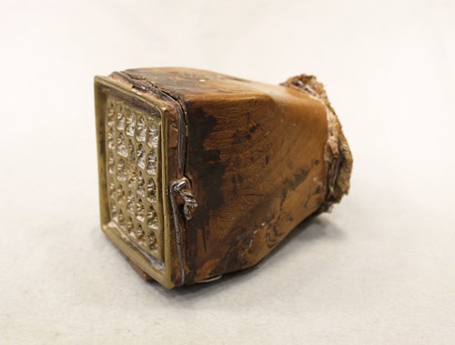 Lot 438 - A Tibetan brass 25-Buddhist deity image votive plaque mould