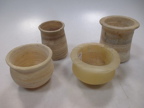 Lot 116 - A group of four turned alabaster...