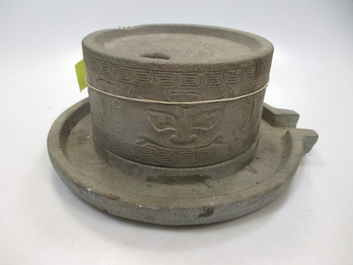 Lot 98 - A Chinese stone grinder, in archaic style,...