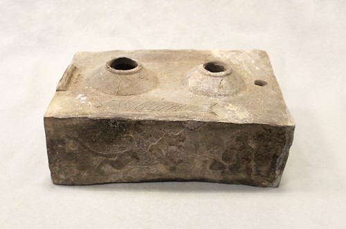 Lot 442 - A Chinese grey pottery model of a stove, Western Han Dynasty, 1st/2nd century BC