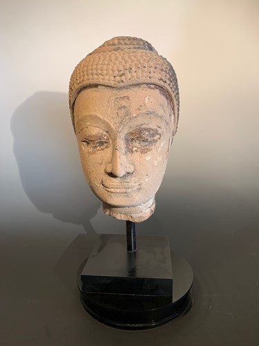 Lot 443 - A carved and lacquered stone Buddha head, Thailand, Sukhothai, 18th/19th century