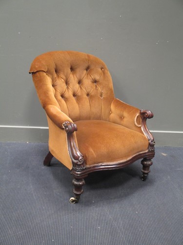 Lot 764 - A Victorian mahogany framed armchair, on white...