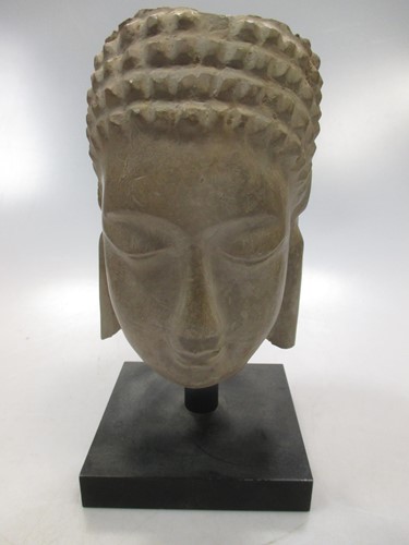 Lot 156 - An Indian carved and painted stone figure of a...