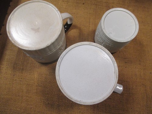 Lot 323 - Three Castleford type pottery porter mugs,...