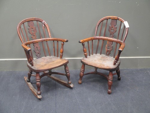 Lot 872 - A Victorian child's yew and elm rocking...
