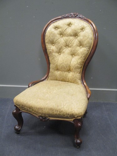 Lot 883 - A Victorian walnut button back nursing chair...