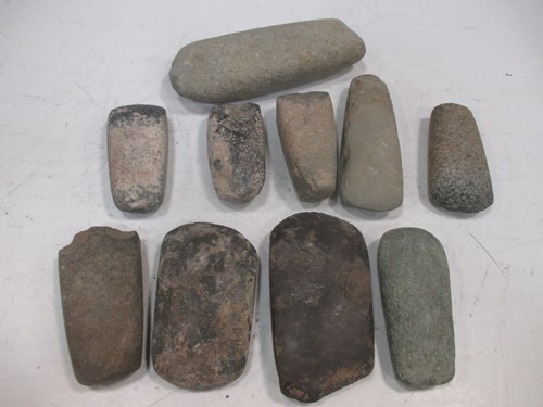 Lot 73 - A collection of Neolithic axe heads in a box