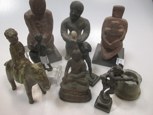 Lot 119 - A group of various carved stone and wood...