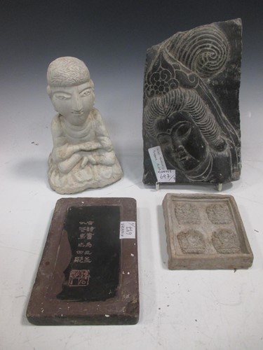Lot 86 - A Chinese carved black stone plaque, in Ming...
