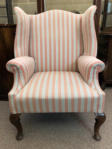 Lot 496 - A 19th century wingback armchair