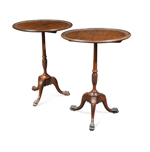 Lot 915 - A pair of George III style mahogany tripod occasional tables