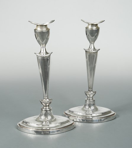 Lot 398 - A pair of George V silver candlesticks