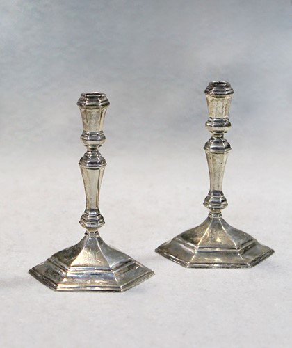 Lot 412 - A pair of 20th century cast silver taper sticks