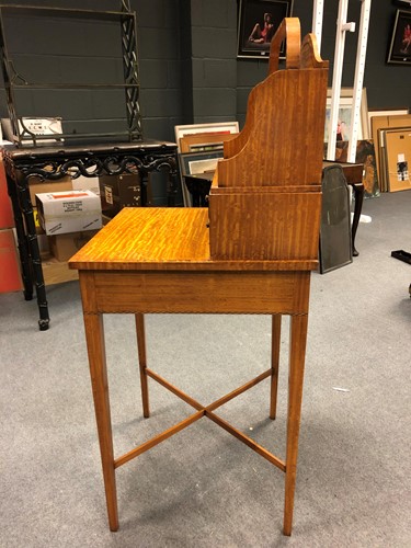 Lot 960 - A Regency style satinwood cheveret