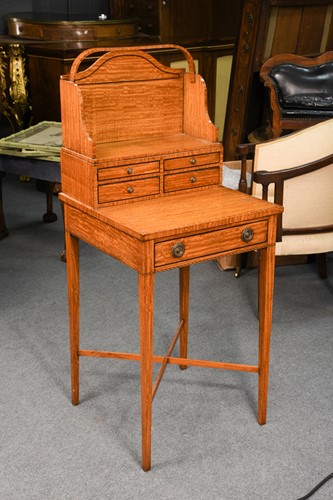 Lot 960 - A Regency style satinwood cheveret
