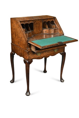Lot 899 - A George I style miniature mulberry bureau on stand