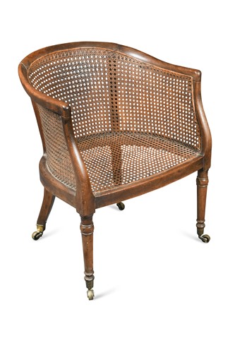 Lot 955 - A Regency mahogany caned library bergere tub chair