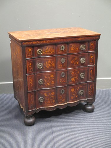 Lot 662 - A Dutch marquetry commode with four long...