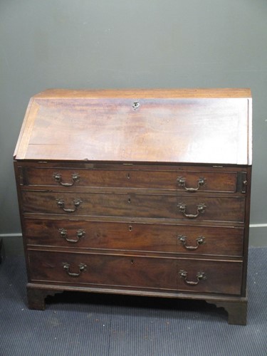 Lot 590 - A George III mahogany bureau, the fall front...
