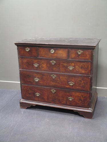 Lot 572 - An 18th century walnut chest of drawers with a...