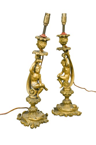 Lot 822 - A pair of 19th century gilt bronze Rococo revival candlesticks