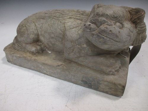 Lot 69 - A Chinese carved limestone recumbent...