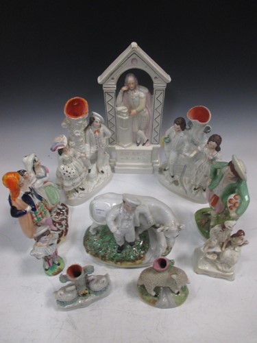 Lot 251 - Nine Victorian Staffordshire pottery figures,...