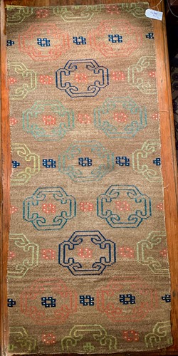 Lot 469 - A Tibetan wool rug, circa 1900-1930