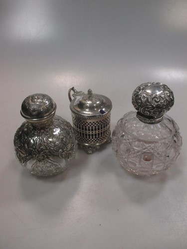 Lot 437 - Two silver mounted cut glass scent bottles,...