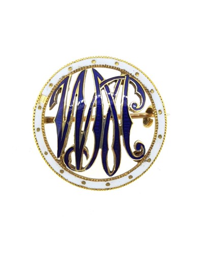 Lot 78 - A circular enamelled monogram brooch