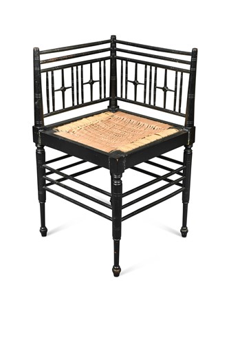 Lot 136 - A Morris & Co. ebonised corner chair