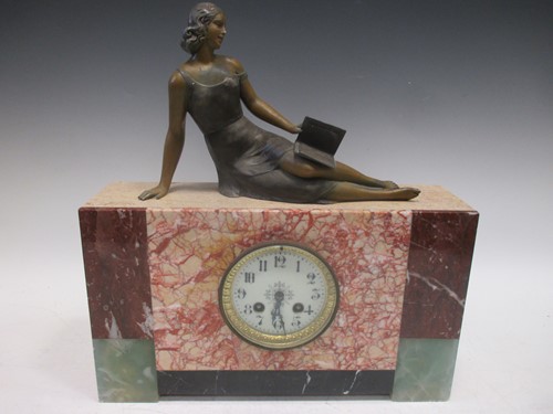 Lot 137 - An Art Deco marble mantle clock, surmounted...