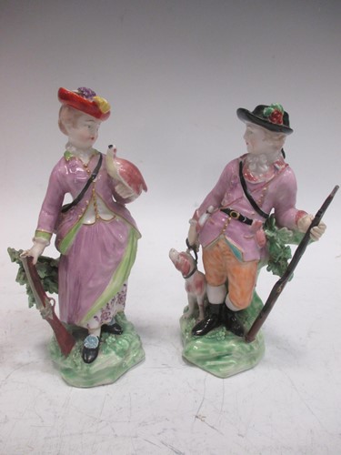 Lot 108 - A pair of Derby patch marked figures of hunters