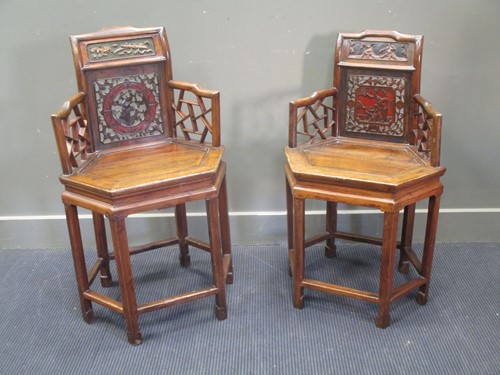 Lot 725 - A pair of Chinese elbow chairs (2)