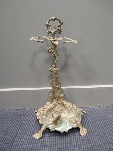 Lot 676 - A 19th century brass umbrella stand, the back...