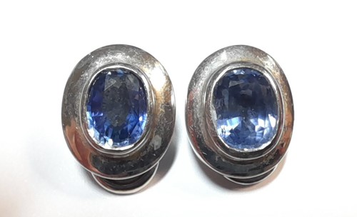 Lot 215 - A pair of sapphire ear clips set in 18ct white gold