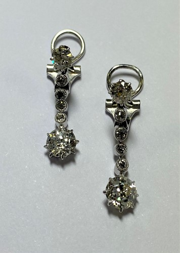 Lot 217 - A pair of diamond set articulated earpendants
