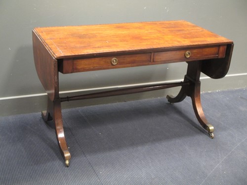 Lot 610 - A Regency mahogany sofa table, the rounded...