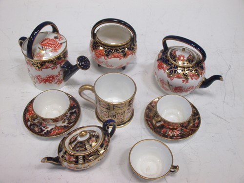 Lot 106 - A group of Royal Crown Derby miniature Imari...