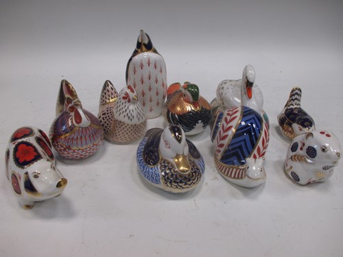 Lot 41 - A group of Royal Crown Derby paperweights to...