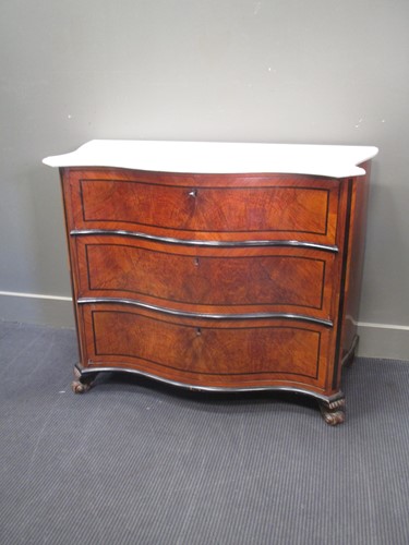 Lot 667 - A marble top serpentine chest of three drawers,...