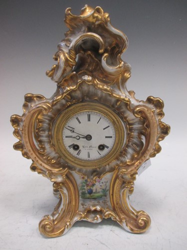 Lot 129 - A French porcelain mantel clock, the drum...