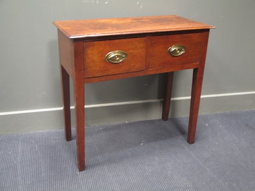 Lot 554 - An 18th century oak side table with two deep...