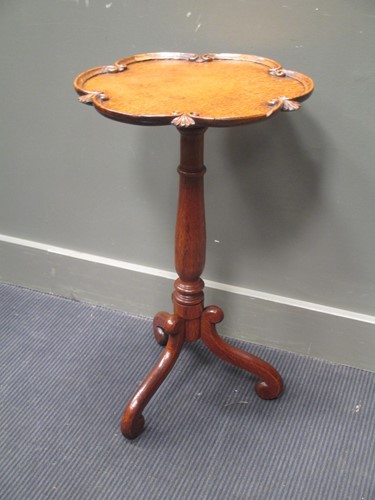 Lot 648 - A late Victorian oak wine table, the dished C...