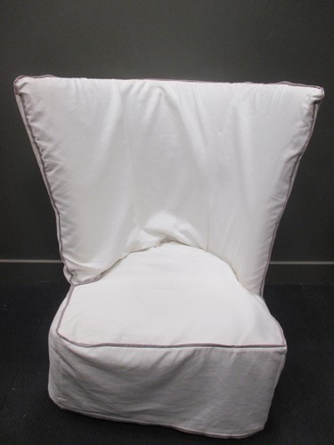Lot 630 - A modern wing back armchair, retailed by 'Oka",...
