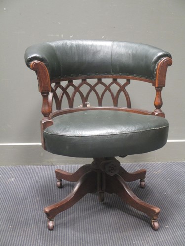 Lot 643 - An Edwardian oak framed desk chair